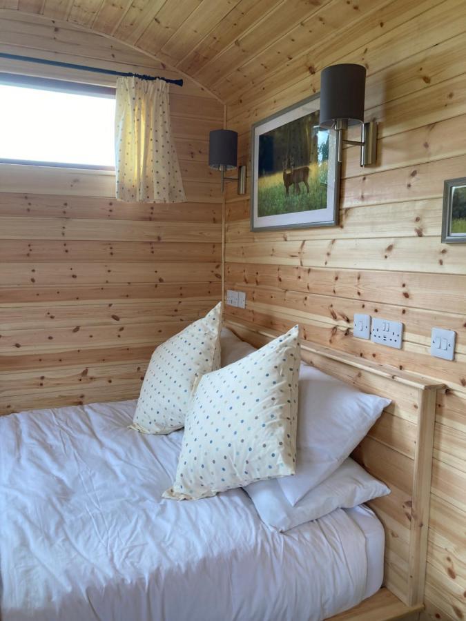 Shepherd's Huts In Barley Meadow At Spring Hill Farm